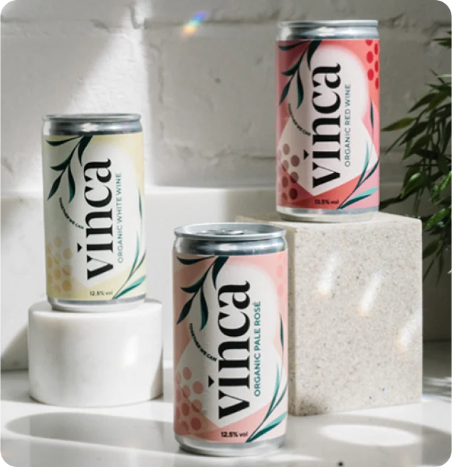 Vinca canned wine varieties on display — each can carries a SmartLinks GS1 Digital Link QR code