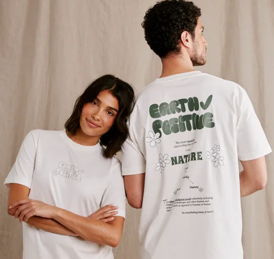 Models wearing Earth Positive sustainable cotton t-shirts — connected merchandise powered by SmartLinks NFC tags